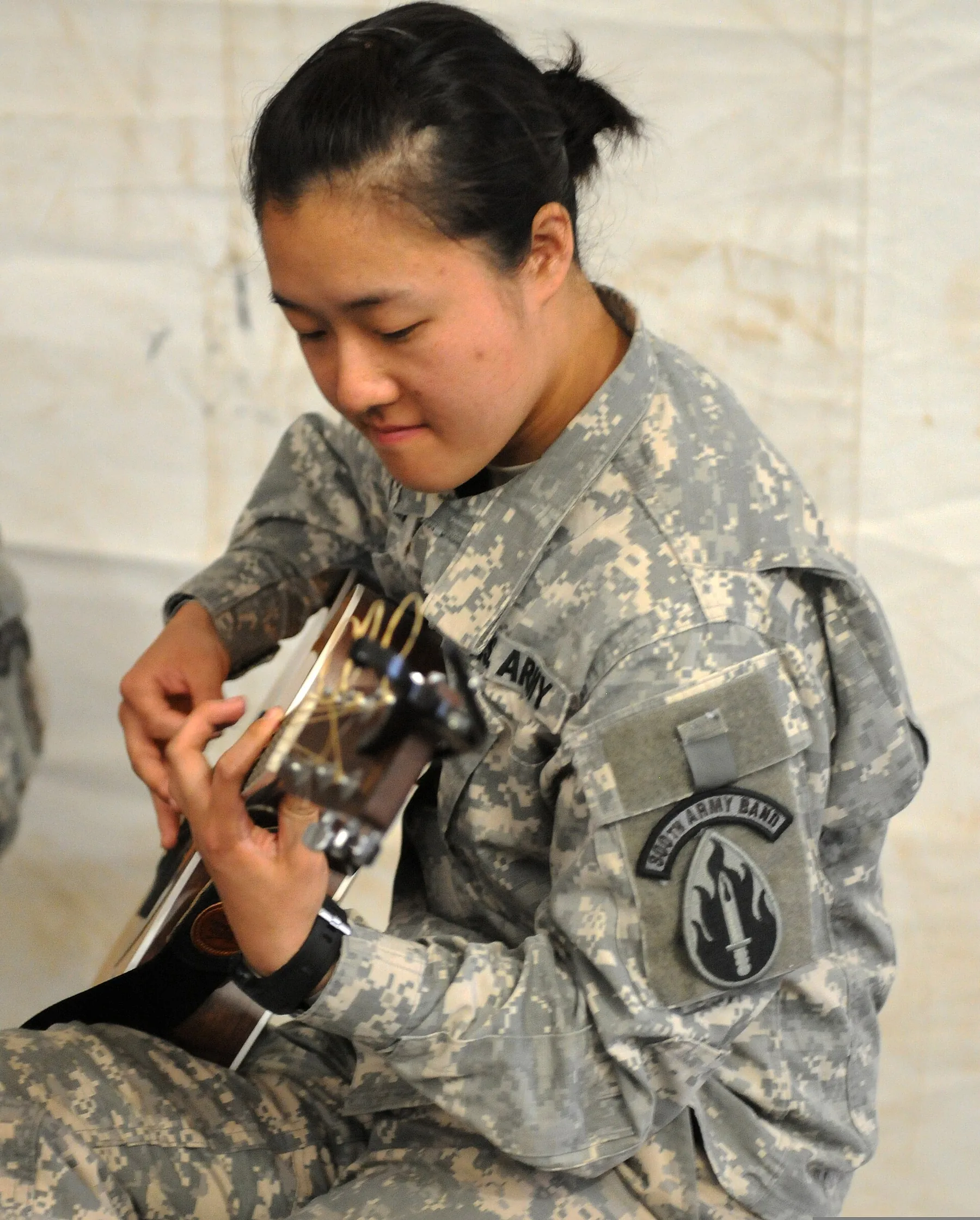 person learning acoustic guitar person learning acoustic guitar