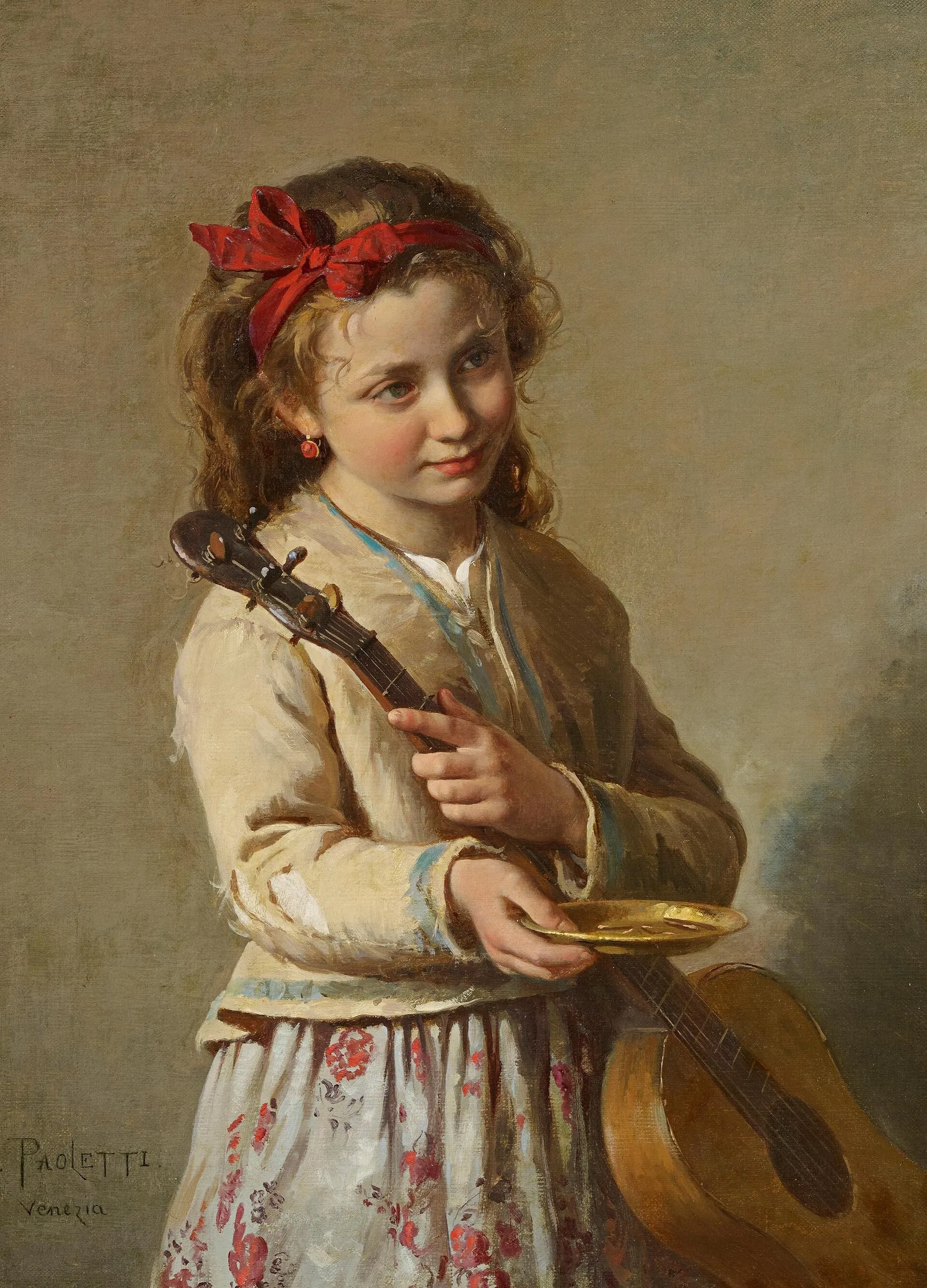 Young musician holding a classical guitar