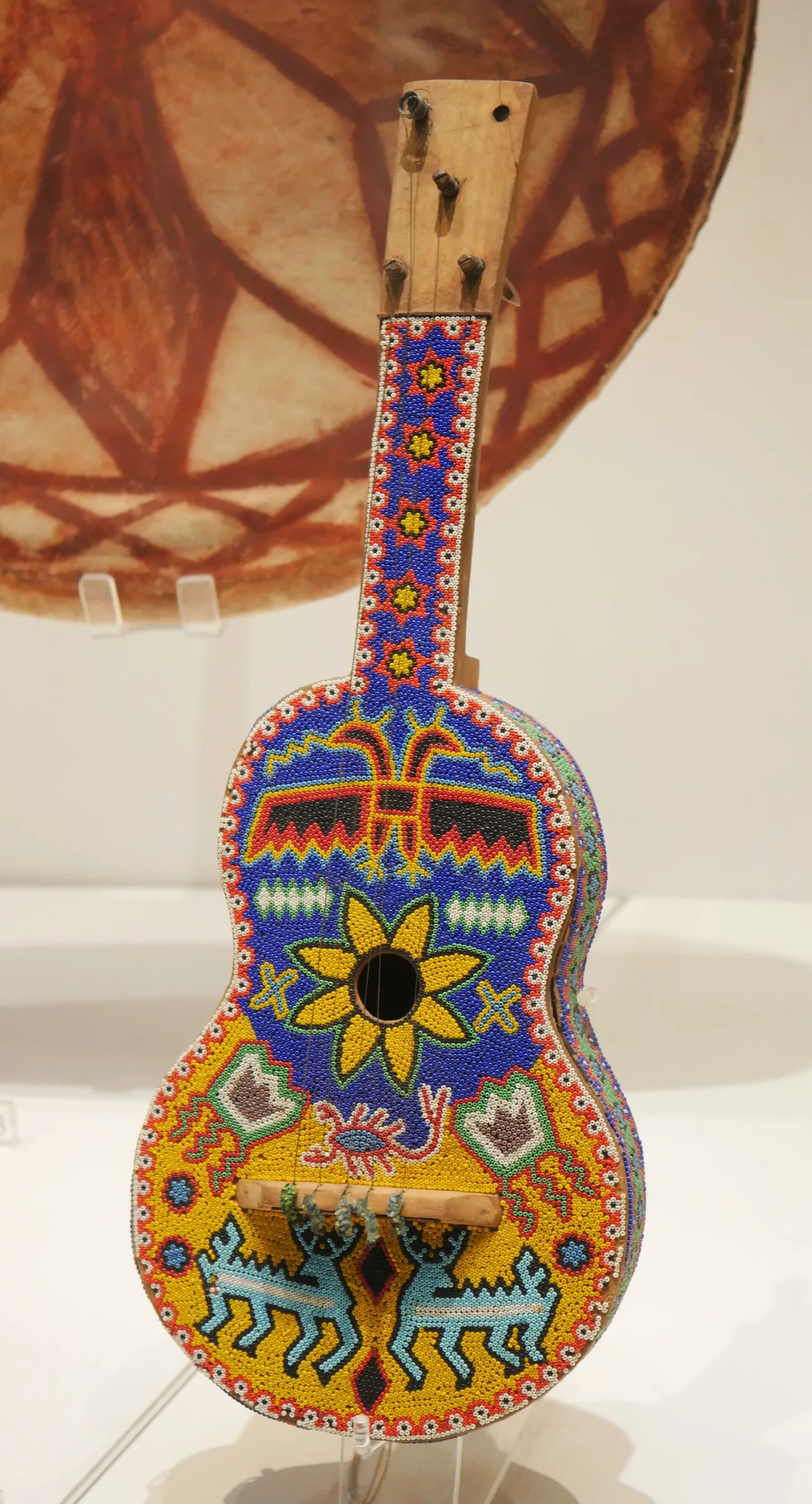 Decorated folk guitar with visible strings