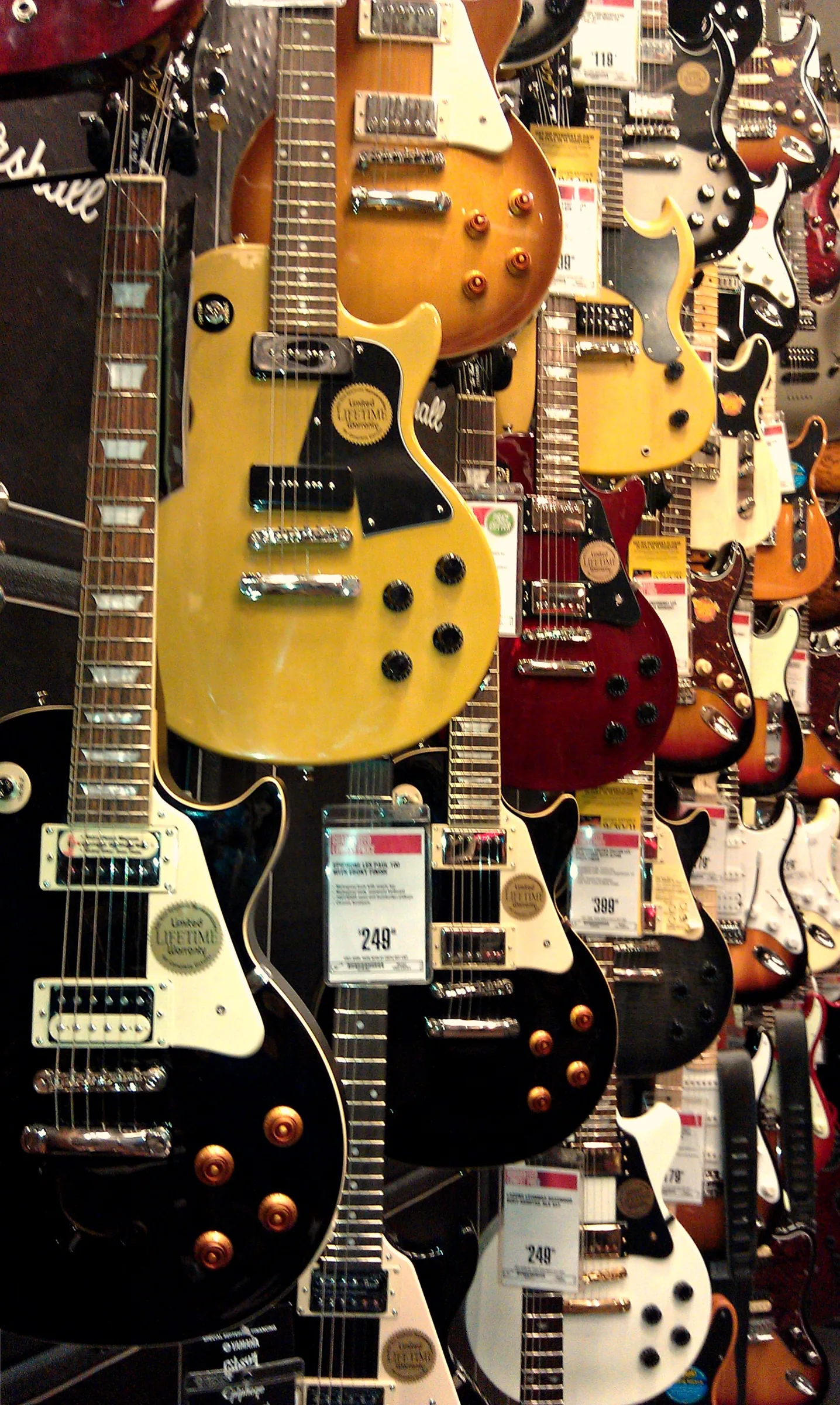 electric guitars displayed in a store