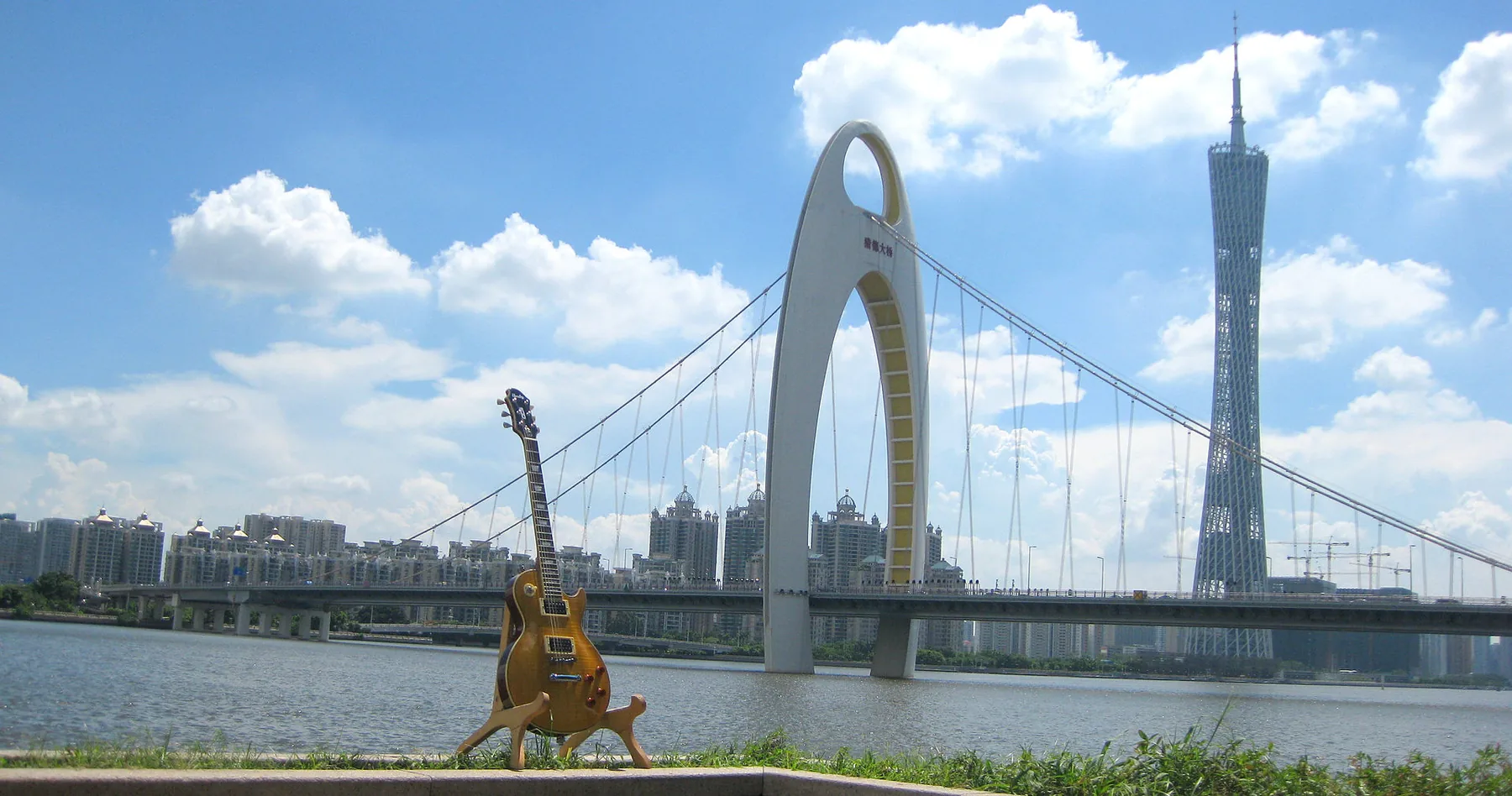 guitar near an urban bridge guitar near an urban bridge