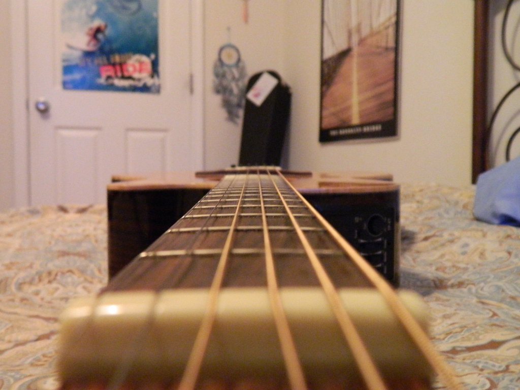 Acoustic guitar image acoustic guitars guitar strings neck with visible details on a wooden acoustic instrument