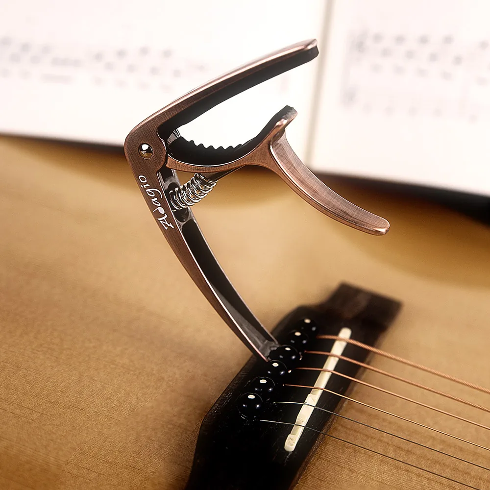 capo attached to acoustic guitar capo attached to acoustic guitar