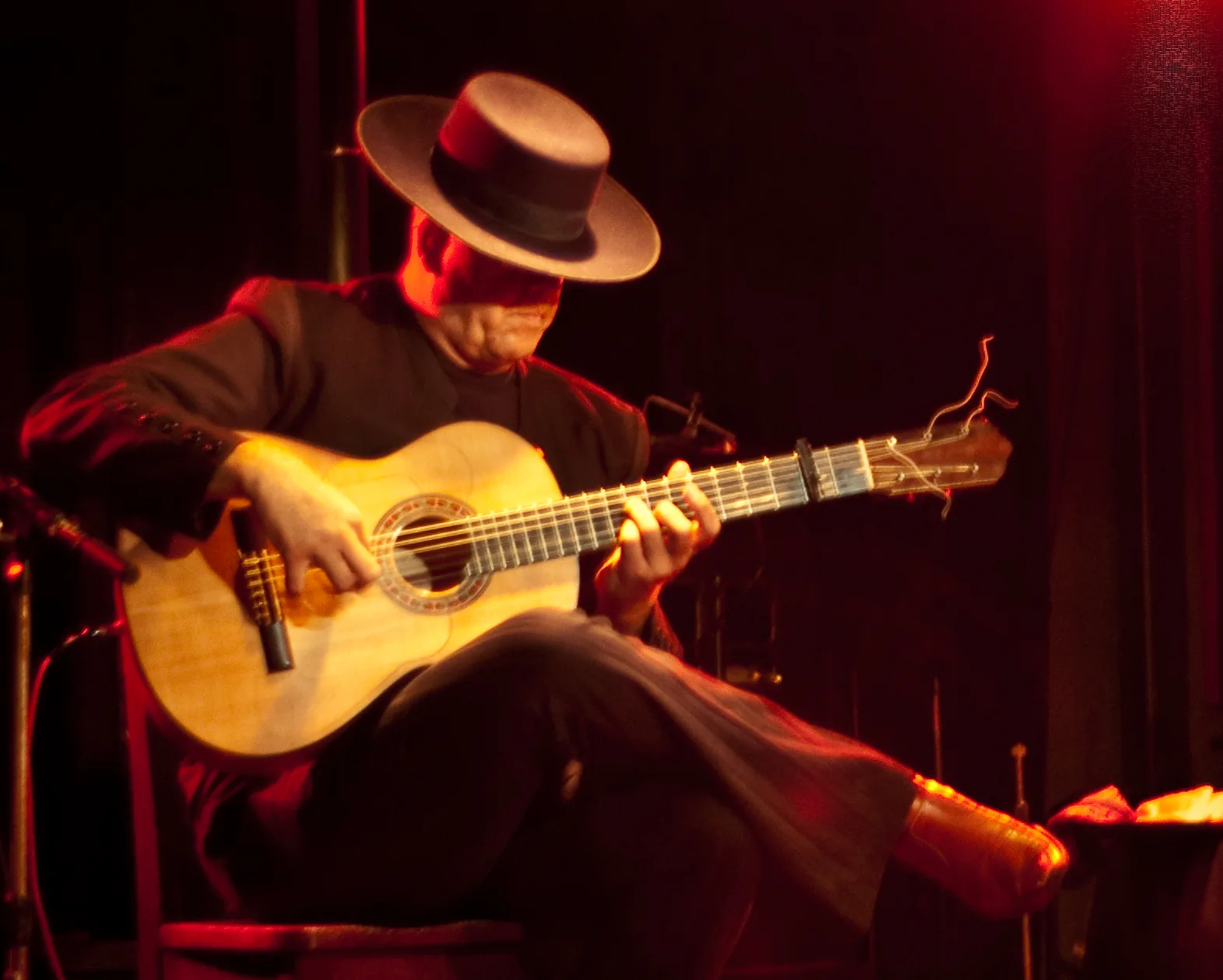 guitarist using a capo on guitar guitarist using a capo on guitar