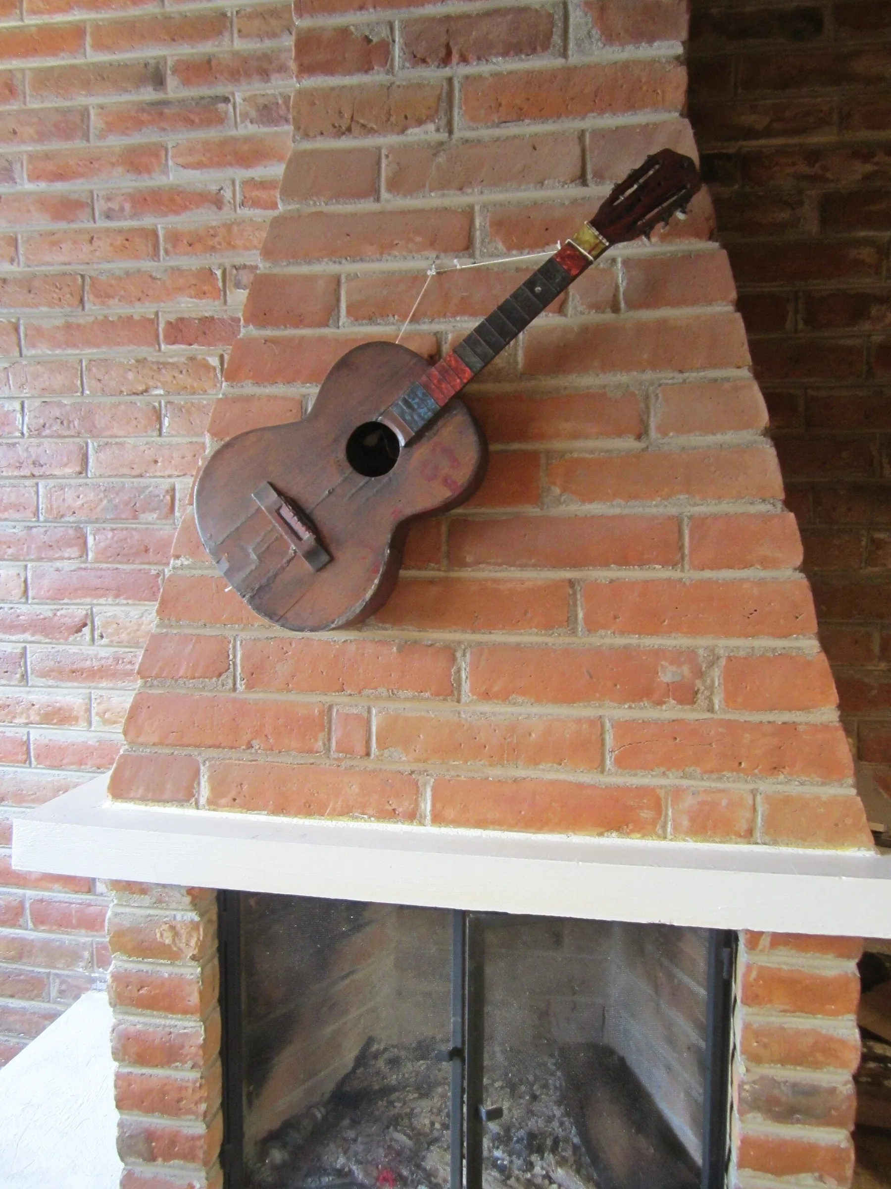 old acoustic guitar hanging