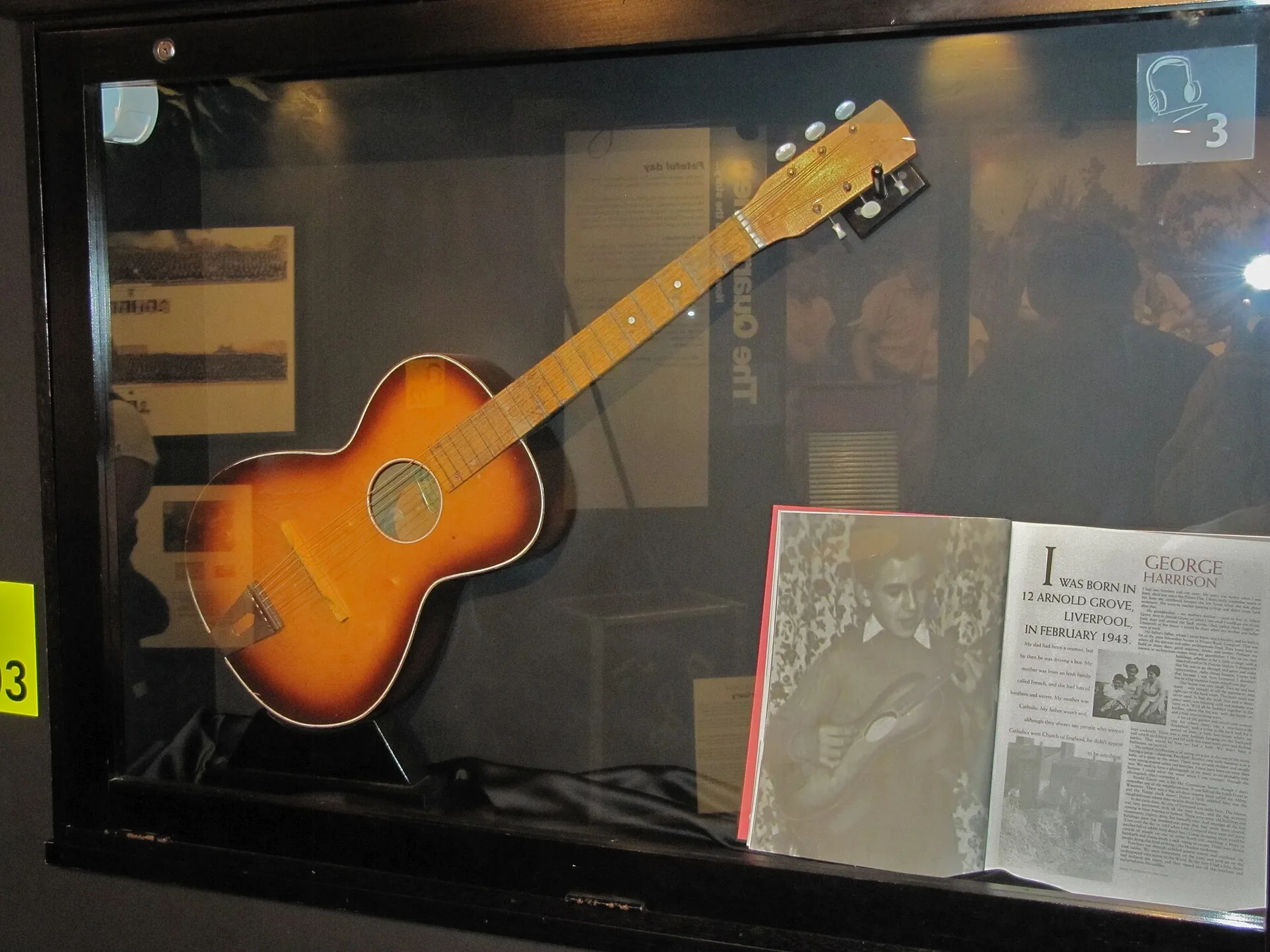 acoustic guitar displayed in a shop window acoustic guitar displayed in a shop window