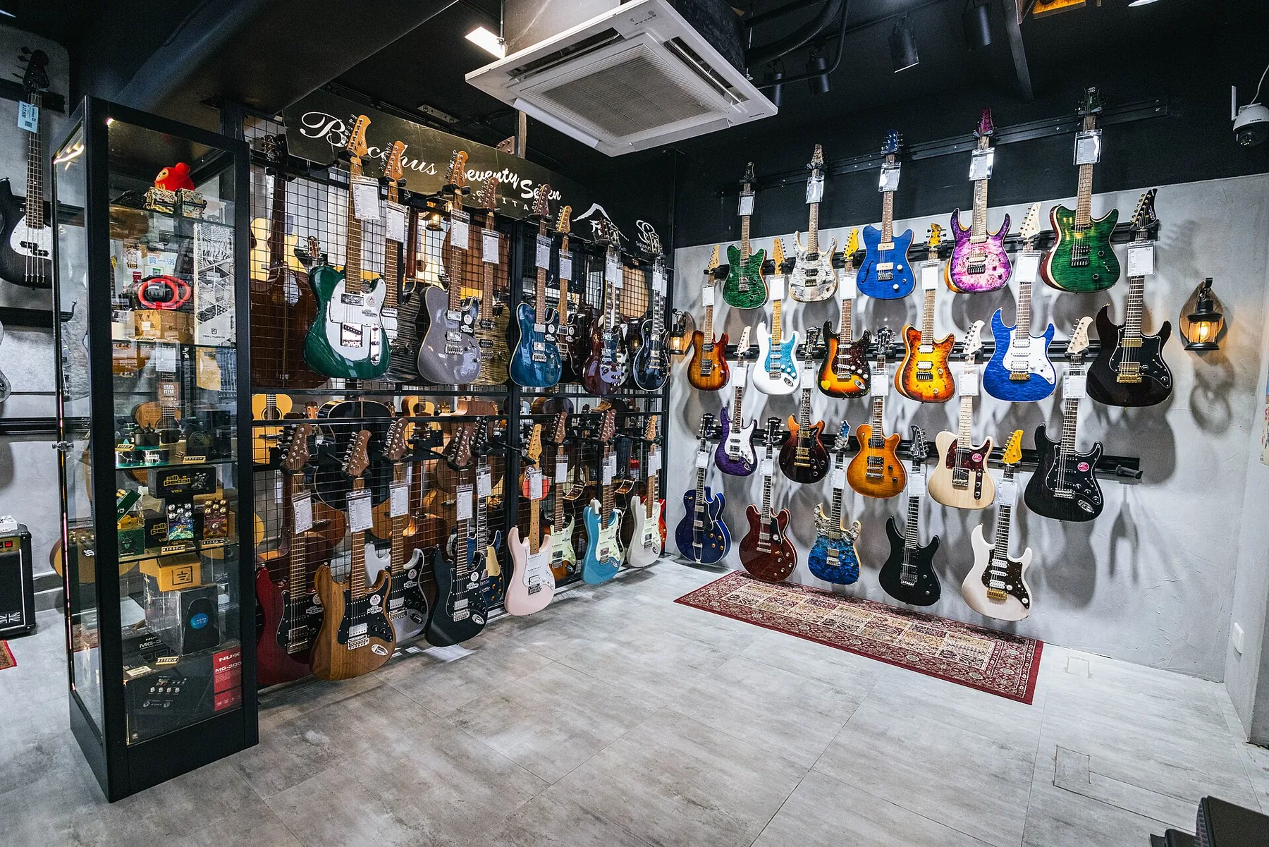 wall of guitars in a store wall of guitars in a store